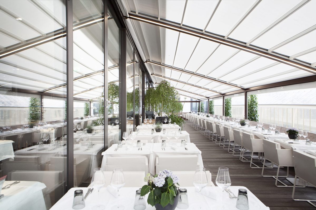 The electric roof deployed over the terrace at Chez Philippe